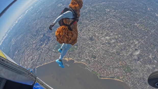 KFC giant drumstick jumps out of a plane to celebrate UberEats deliveries.