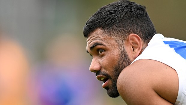 Former AFL player Tarryn Thomas has avoided a criminal conviction after police dropped a charge of using a telecommunications service to harass a woman.