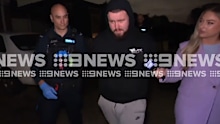 The 19-year-old smirked as he was marched from his Tarneit home before dawn.