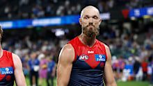 Melbourne's Max Gawn and Harry Petty leave the field after the loss to North.