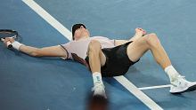 MELBOURNE, AUSTRALIA - JANUARY 28: Jannik Sinner of Italy celebrates winning championship point in their Men's Singles Final match against Daniil Medvedev during the 2024 Australian Open at Melbourne Park on January 28, 2024 in Melbourne, Australia. (Photo by Darrian Traynor/Getty Images)