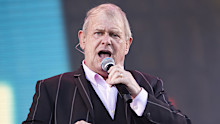 John Farnham, pictured performing in 2020, has confirmed he will never sing in public again.
