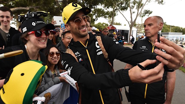 Dan Ricciardo takes a selfie with fans.