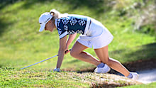EVIAN-LES-BAINS, FRANCE - JULY 10: Charley Hull of England falls as she climbs out of a bunker on the third hole, before later withdrawing from play, during Round One of The Amundi Evian Championship 2025 at Evian Resort Golf Club on July 10, 2025 in Evian-les-Bains, France. (Photo by Stuart Franklin/Getty Images)