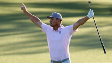 Bryson DeChambeau celebrates after chipping in for birdie on the 18th green.