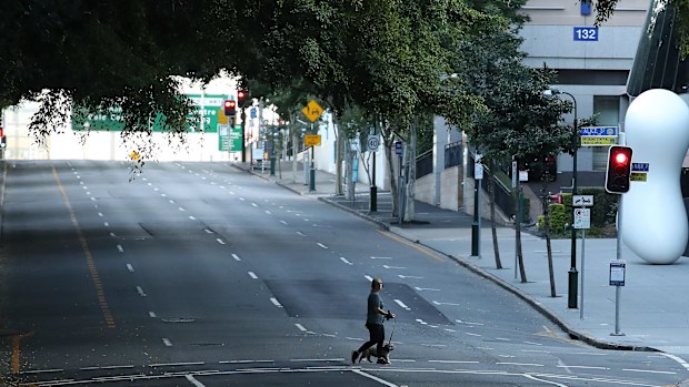 BRISBANE, AUSTRALIA - JULY 31: People are seen walking near the Brisbane CBD after lockdown on July 31, 2021 in Brisbane, Australia. Eleven local government areas in south-east Queensland will enter into a three-day lockdown from 4pm today as six new locally transmitted cases of the Covid-19 delta variant were reported.  (Photo by Jono Searle/Getty Images)