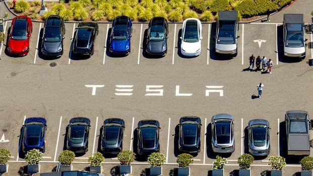 Tesla vehicles line a parking lot at the company's Fremont, Calif., factory