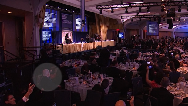 In now viral footage, a seemingly unfazed man stood out for remaining seated at his table, tucking into his burrata pea salad while other guests screamed and hid under tables amid a shooting at the White House Correspondents Dinner.
