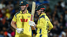 Cooper Connolly celebrates his half-century with Mitch Owen.