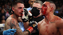 NEW YORK, NEW YORK - NOVEMBER 27:  Teofimo Lopez and  George Kambosos talk after their championship bout for Lopezs Undisputed Lightweight title at The Hulu Theater at Madison Square Garden on November 27, 2021 in New York, New York. (Photo by Al Bello/Getty Images)