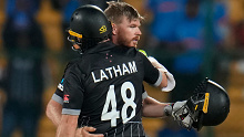 New Zealand's Tom Latham hugs batting partner Glenn Phillips to celebrate their win.