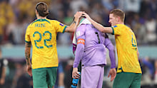 Jackson Irvine and Kye Rowles console goalkeeper Mat Ryan after his mistake against Argentina.