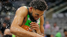 Karl-Anthony Towns #32 of the Minnesota Timberwolves gets a water bath after scoring 60 points against the San Antonio Spurs at AT&T Center. 