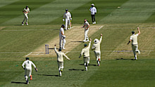Australia celebrates a wicket at the MCG.