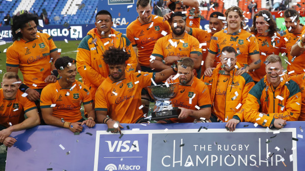 James Slipper of Australia and teammates celebrate with the trophy.