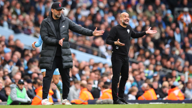 Jurgen Klopp the head coach / manager of Liverpool and Pep Guardiola the head coach / manager of Manchester City during the Premier League match between Manchester City and Liverpool at Etihad Stadium on April 10, 2022 in Manchester, United Kingdom. (Photo by Robbie Jay Barratt - AMA/Getty Images)