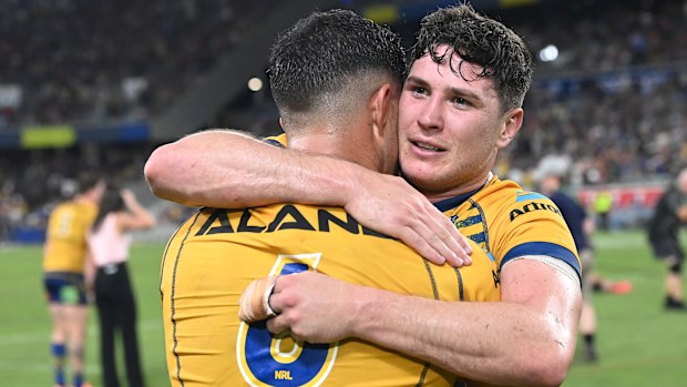 Mitchell Moses embraces Dylan Brown following the NRL Preliminary Final match between the North Queensland Cowboys and the Parramatta Eels at Queensland Country Bank Stadium on September 23, 2022 in Townsville, Australia. (Photo by Bradley Kanaris/Getty Images)