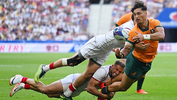 Jordan Petaia of Australia is tackled by Miriani Modebadze of Georgia.