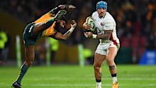 Jack Nowell of England evades the tackle from Marika Koroibete of the Wallabies.