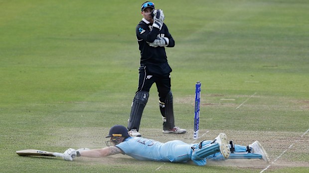 Ben Stokes dives to make his ground, deflecting the ball to the boundary.