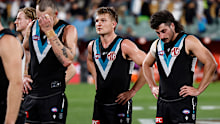 Charlie Dixon, Ollie Wines and Lachie Jones react after the loss to Geelong. 