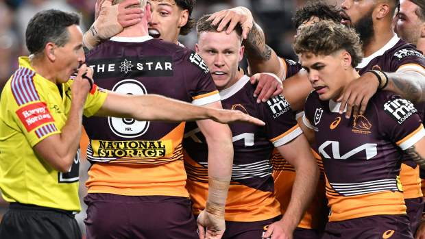 Billy Walters celebrates with Broncos teammates.