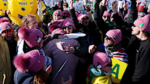 LIVIGNO, ITALY - FEBRUARY 13: Fans of Team Australia celebrate after Josie Baff of Team Australia wins the gold medal in the Women's Snowboard Cross Big Final on day seven of the Milano Cortina 2026 Winter Olympic games at Livigno Snow Park on February 13, 2026 in Livigno, Italy. (Photo by Patrick Smith/Getty Images)