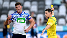 Referee Paul Williams issues Roger Tuivasa-Sheck of the Blues a yellow card.