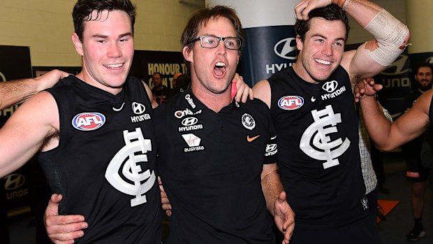 David Teague (centre) enjoys strong support from Carlton players.