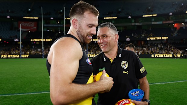MELBOURNE, AUSTRALIA - APRIL 19: Noah Balta of the Tigers and Adem Yze, Senior Coach of the Tigers celebrates during the 2025 AFL Round 06 match between the Richmond Tigers and the Gold Coast Suns at Marvel Stadium on April 19, 2025 in Melbourne, Australia. (Photo by Michael Willson/AFL Photos via Getty Images)