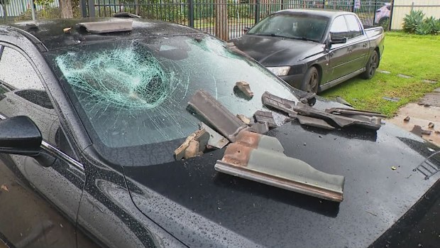 Roof tiles were blown off and cars were damaged as winds exceeded 130 km/h across Adelaide's northern suburbs.
