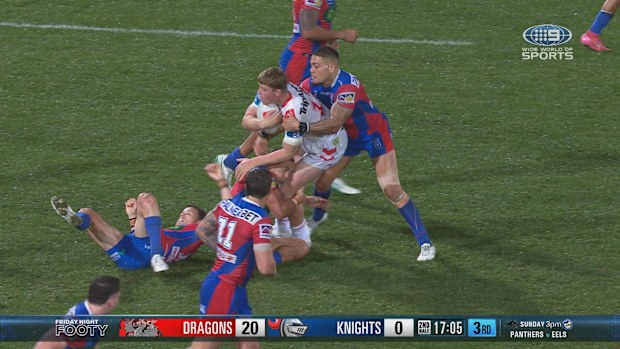 Leo Thompson performing a crusher tackle on Hamish Stewart.