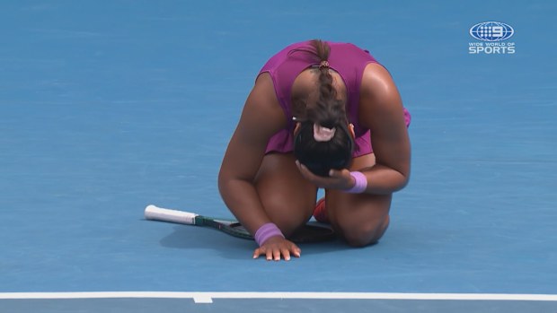 Destanee Aiava falls to the court after learning she qualified for the Australian Open. 