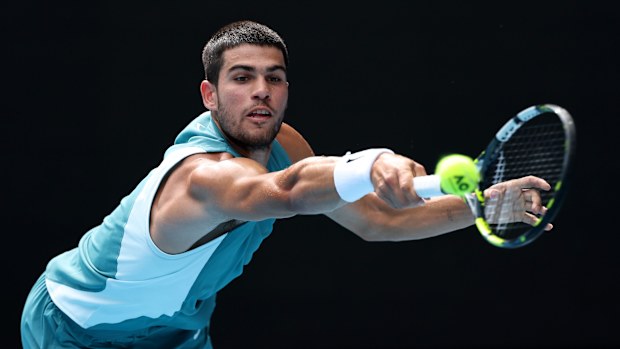 Carlos Alcaraz of Spain plays a backhand against Jack Draper of Great Britain.