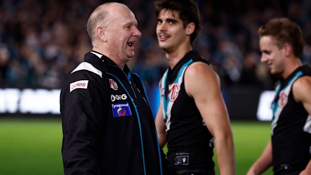 Power coach Ken Hinkley sprays Hawks players after their final.