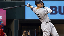 ARLINGTON, TX - OCTOBER 4:  Aaron Judge #99 of the New York Yankees hits his 62nd home run of the season against the Texas Rangers during the first inning in game two of a double header at Globe Life Field on October 4, 2022 in Arlington, Texas. Judge has now set the American League record for home runs in a single season. (Photo by Ron Jenkins/Getty Images)