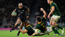 Mark Telea of New Zealand is challenged by Duane Vermeulen of South Africa.
