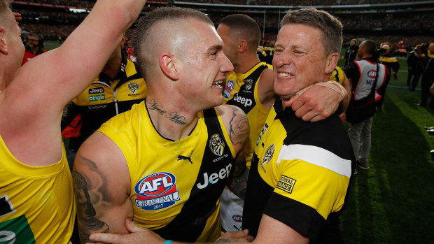 Dustin Martin and Damien Hardwick celebrate Richmond's victory in the 2017 AFL grand final.