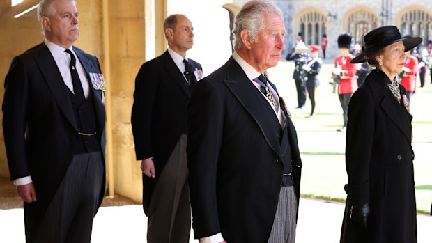 From left, Prince Andrew, Prince Edward, Prince Charles and Princess Anne arrive after walking in a procession behind the coffin of Prince Philip, with other members of the Royal family during the funeral of Britain's Prince Philip inside Windsor Castle in Windsor, England, Saturday, April 17, 2021. Prince Philip died April 9 at the age of 99 after 73 years of marriage to Britain's Queen Elizabeth II.