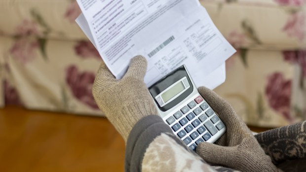 Worried mature man reading power cut notification letternews,  holding heating bill, He is confused and astonished by unbelievable news: high bill tax invoice, debt notification, bad financial report, money problem