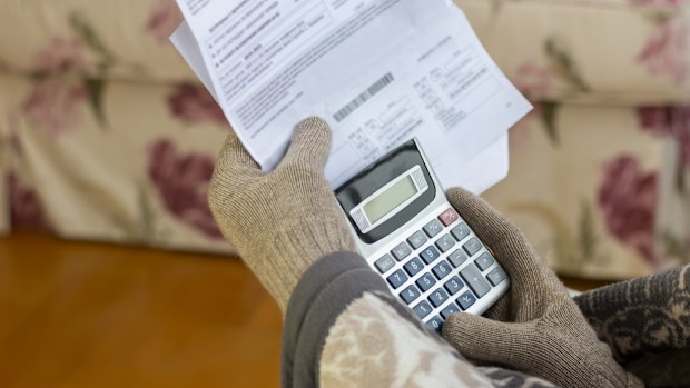Worried mature man reading power cut notification letternews,  holding heating bill, He is confused and astonished by unbelievable news: high bill tax invoice, debt notification, bad financial report, money problem