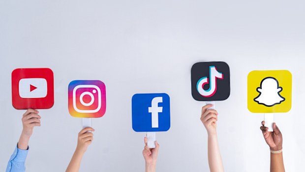 Teenagers hands hold social media signs in their hands: Youtube, Snapchat, Instagram, Tiktok, Facebook. Teenagers addicted to new technology trends - concept of youth, technology, social and friendship. Turkey, Istanbul, May 29, 2022.