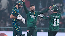 Pakistan's Mohammad Nawaz celebrates with teammates after the dismissal of Australia's Matthew Short.