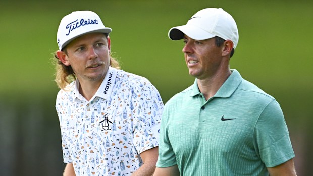 Cameron Smith of Australia and Rory McIlroy of Northern Ireland walk on the 18th hole during the second round of the TOUR Championship at East Lake Golf Club on August 26, 2022 in Atlanta, Georgia. (Photo by Chris Condon/PGA TOUR)