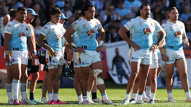 Titans players look dejected after a Sharks try.