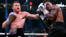 Saul "Canelo" Alvarez of Mexico trades punches with Jermell Charlo during their super middleweight title fight at T-Mobile Arena on September 30, 2023 in Las Vegas, Nevada.  