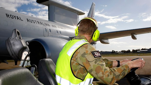 Ground crew prepare the Wedgetail early warning aircraft.