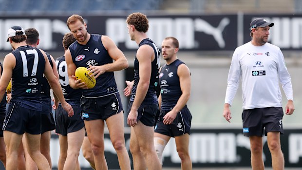 Josh Fraser (R) takes over Carlton training.