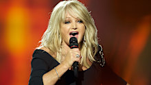 MALMO, SWEDEN - MAY 18: Bonnie Tyler of the United Kingdom performs on stage during the grand final of the Eurovision Song Contest 2013 at Malmo Arena on May 18, 2013 in Malmo, Sweden. (Photo by Ragnar Singsaas/Getty Images)