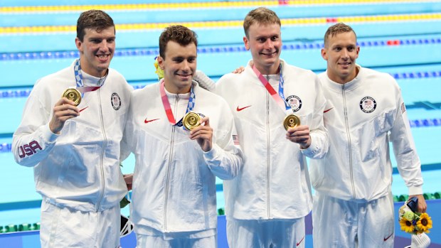 Zach Apple, Blake Pieroni, Bowen Becker and Caleb Dressel celebrate their relay win.